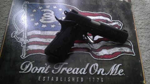 2000 Mercury Grand Marquis - Pistol displayed on a "Don't Tread On Me" flag graphic with "Established 1776" text.