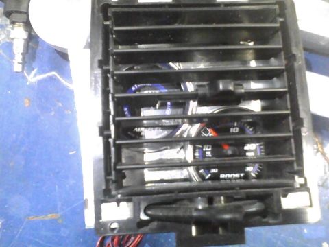 2003 Ford Crown Victoria - Custom gauges installed behind a car's air vent.
