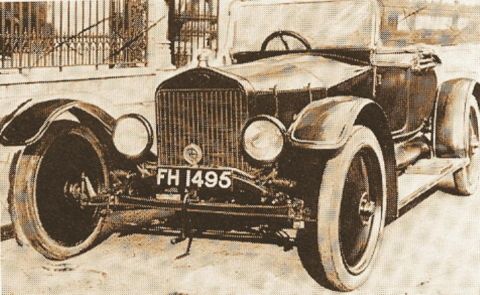 1909 Ford Model T - This touring car, identified by license plate FH 1495, appears to be from the 1910s.