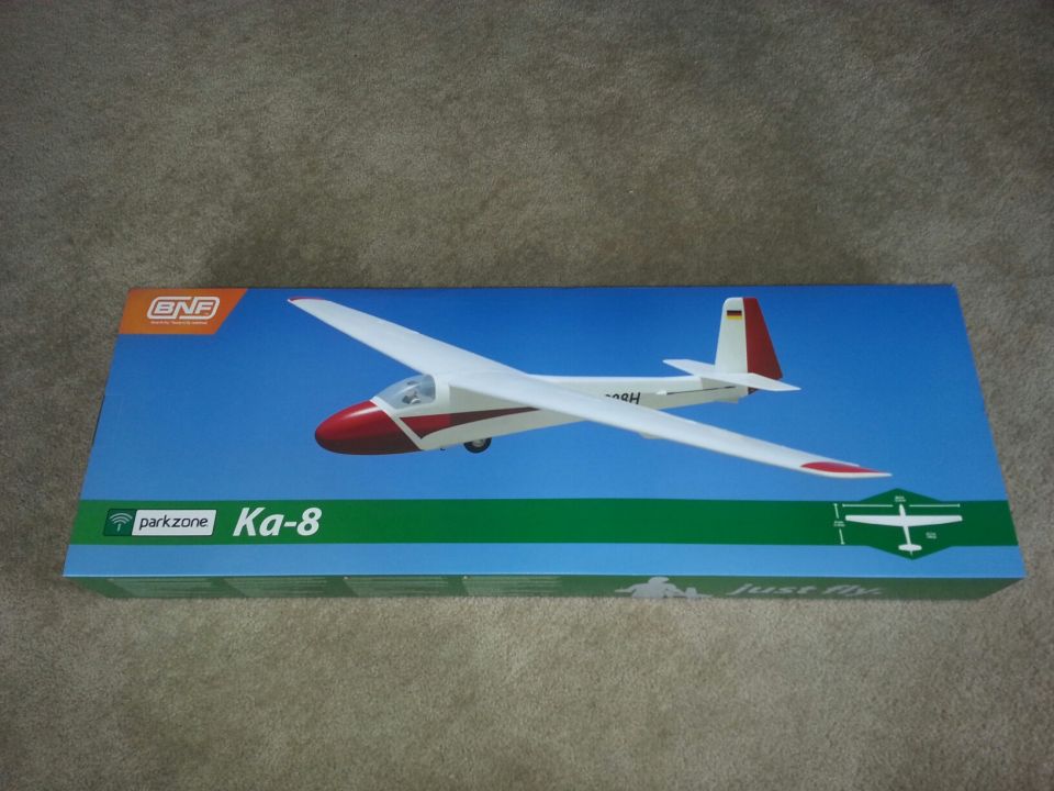 Model airplane, labeled Ka-8, on a box