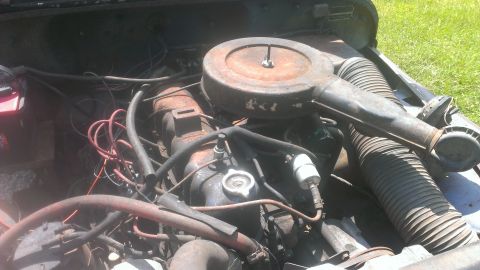 1978 Ford Bronco - Close-up view of an engine bay, showing the V8 engine and associated components.