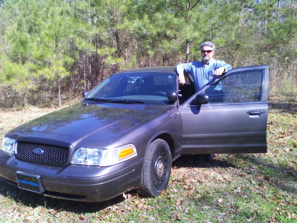 2004 Ford Crown Victoria, dark gray, 3q front view with driver's door open