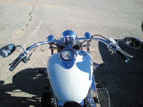1995 Ford F-150 - View from the rider's perspective of a motorcycle's handlebars and dashboard.