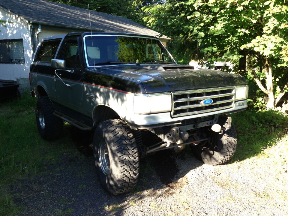 Black and gray lifted Ford Bronco, front 3/4 view