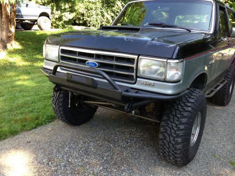 1989 Ford Bronco - This Ford Bronco features a heavy-duty aftermarket bumper and off-road tires, suggesting modifications beyond its original factory configur…