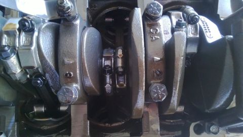 1994 Ford Bronco - Close-up view of engine crankshaft and connecting rods, showing internal mechanical components.