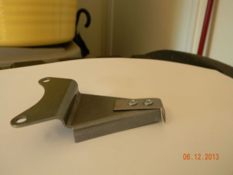 1995 Ford Bronco - used two 1/8 steel rivots and attached the bracket to the pump arm, had to cut it after assy, it was too long