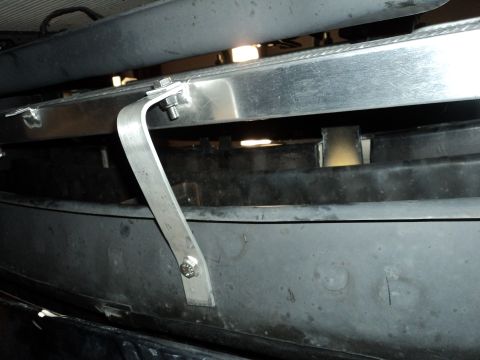 2004 Mercury Grand Marquis - Custom aluminum bracket secures the radiator assembly to the vehicle's front end.