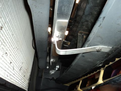 2004 Mercury Grand Marquis - Custom metal brackets are visible near the radiator in this underbody shot.