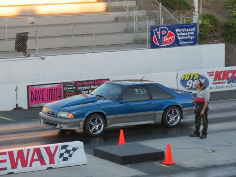 1990 Ford Mustang - Blue 1990 Ford Mustang coupe at the drag strip, ready for a race.