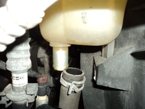 2004 Mercury Grand Marquis - Coolant reservoir and associated hoses, likely from an engine bay.