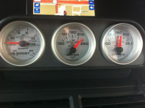 2010 Dodge Challenger - Interior view of a vehicle's dashboard, displaying boost, water temperature, and transmission temperature gauges.