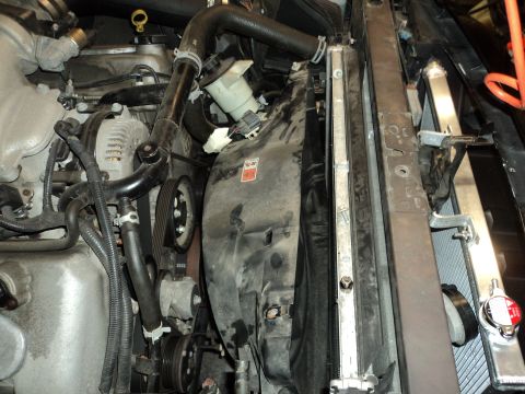 2004 Mercury Grand Marquis - Close-up view of the engine bay, focusing on the radiator and fan assembly.