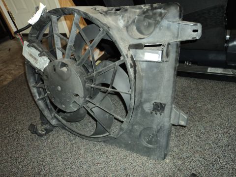 2004 Mercury Grand Marquis - Radiator fan assembly shown from the front, with visible wiring and mounting points.
