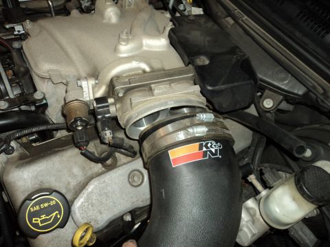 2004 Mercury Grand Marquis - Engine bay detail showing a K&N air intake system and throttle body assembly.