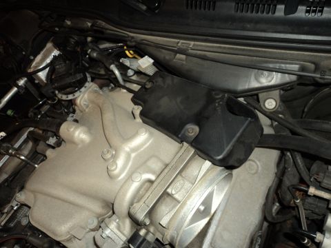 2004 Mercury Grand Marquis - Close-up view of the engine bay, highlighting the intake manifold and throttle body assembly.
