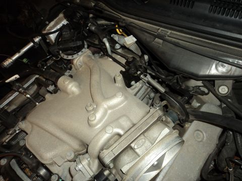 2004 Mercury Grand Marquis - Close-up view of a Ford engine's intake manifold and associated components.