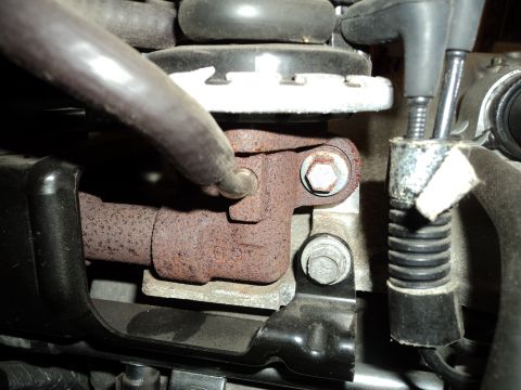 2004 Mercury Grand Marquis - Close-up view of an engine component, showing rusted metal and fasteners.