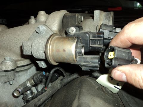 2004 Mercury Grand Marquis - Disconnecting an electrical connector from an engine component.