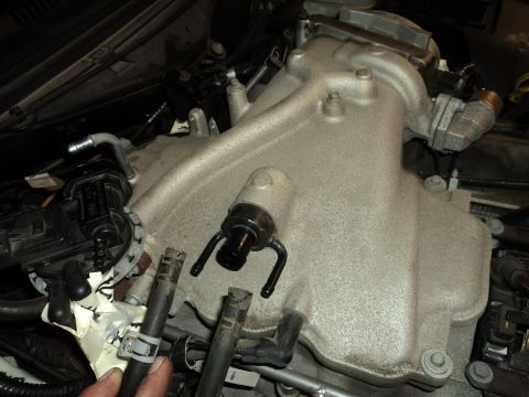 2004 Mercury Grand Marquis - A close-up view of an engine's intake manifold and associated components.