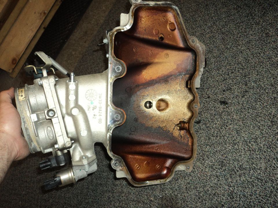 Ford throttle body and intake manifold with oil residue inside
