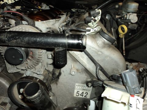 2004 Mercury Grand Marquis - Close-up view of an engine bay, custom plumbing and a sticker with the number 542.