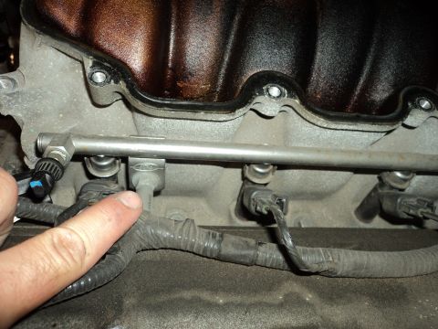 2004 Mercury Grand Marquis - Close-up view of engine fuel injectors and fuel rail assembly.