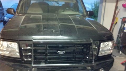1995 Ford Bronco - Front view of a 1995 Ford Bronco parked in a garage.