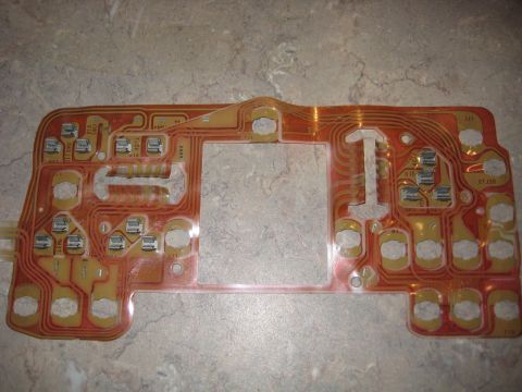 1996 Ford Bronco - This is a circuit board with electronic components and traces, likely from a vehicle's dashboard.