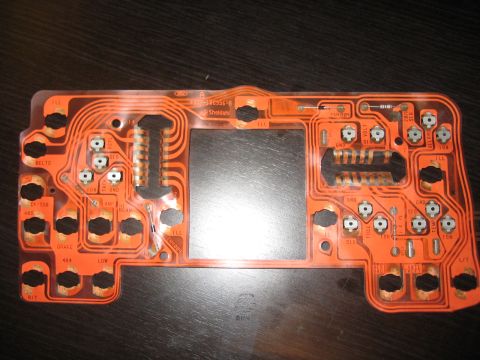1996 Ford Bronco - Circuit board for a vehicle's instrument cluster, showing electrical pathways and connection points.