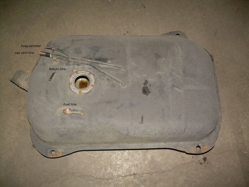 Gray metal fuel tank with labeled lines for fuel, return, and evap canister