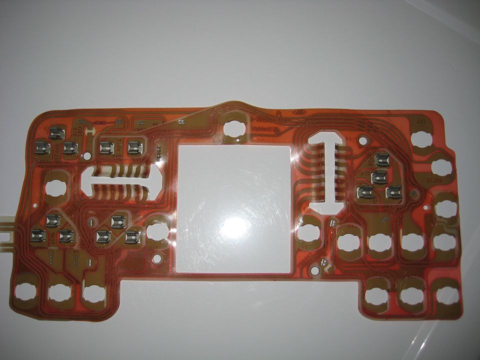 Instrument cluster circuit board with multiple connection points and a large central cutout