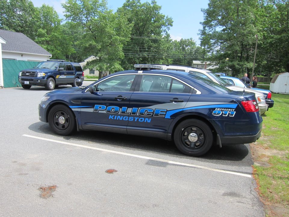 Blue police car with 'POLICE KINGSTON' text on side
