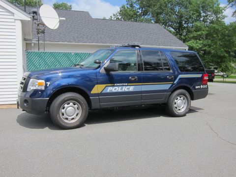 2001 Ford Crown Victoria - Kingston Police SUV, number 7, is a dark blue Ford Expedition with police markings.