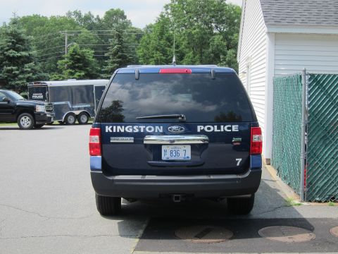 2001 Ford Crown Victoria - Rear view of a dark blue Ford Expedition, likely from the early 2000s.