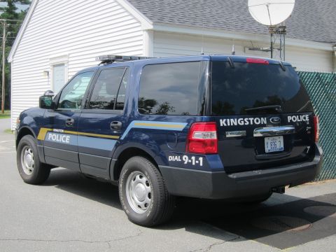 2001 Ford Crown Victoria - A dark blue SUV is parked outdoors, showing its rear and side profile.