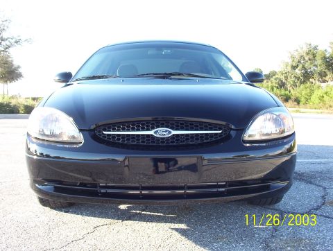 2003 Ford Taurus - Front view of a black 2003 Ford Taurus sedan parked outdoors.