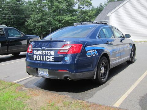 2001 Ford Crown Victoria - Rear view of a blue Ford Police Interceptor with emergency markings.