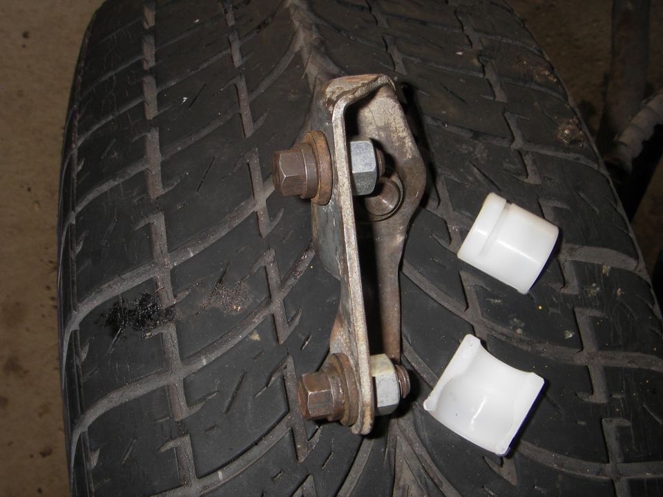 a header bolt(7/16" hex head) and a washer nutted into the frame side pivot to replicate the height of the bolt bosses in the donor car