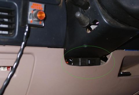 1996 Ford Bronco - Close-up of a vehicle's interior dashboard, showing a control switch and vent.