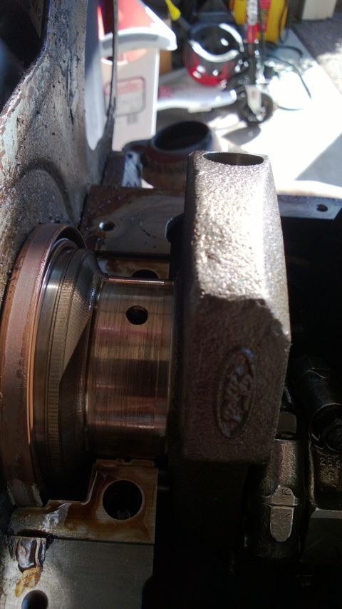 1994 Ford Bronco - Close-up of a Ford engine crankshaft, showing wear on the bearing surfaces.
