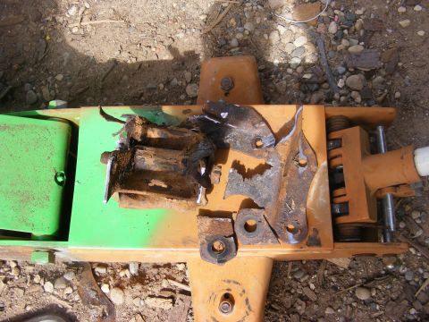 1996 Ford Bronco - Rusted metal parts are laid out on a jack, likely removed from a vehicle.
