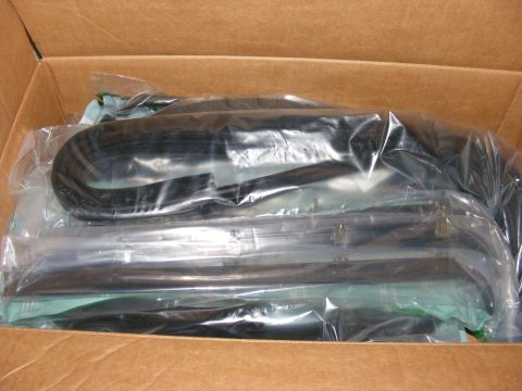 1996 Ford Bronco - Unopened box containing new weatherstripping parts for a vehicle.