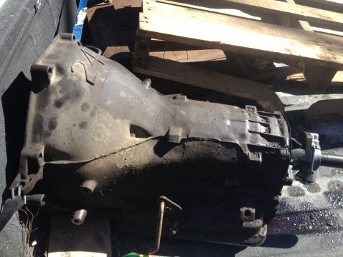 1979 Ford Bronco - This is a close-up view of a used automatic transmission, showing its greasy and worn exterior.