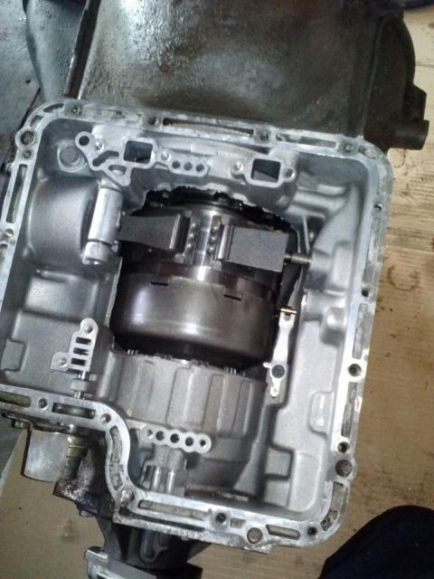 1979 Ford Bronco - Internal components of an automatic transmission are visible after the pan has been removed.