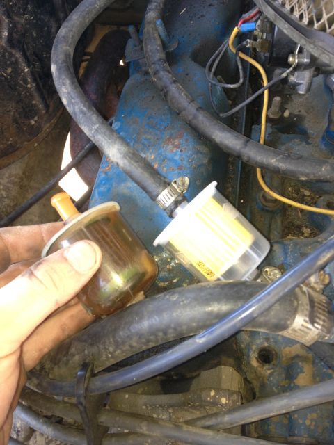 1979 Ford Bronco - Replacing the fuel filter on an engine, showing the old and new parts.