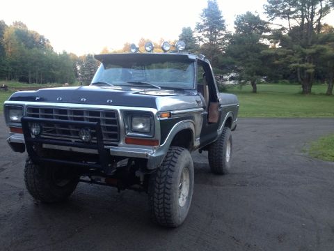 1979 Ford Bronco - This 1979 Ford Bronco features off-road tires and a prominent brush guard, suggesting it's ready for adventure.