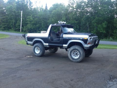 1979 Ford Bronco - This lifted Ford Bronco has off-road tires and a custom front bumper.