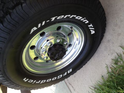 1997 Ford F-350 - Close-up of a BFGoodrich All-Terrain T/A tire and chrome wheel assembly.