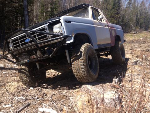 1979 Ford Bronco - This modified 1978 Ford Bronco is shown off-road with a custom front bumper and large tires.